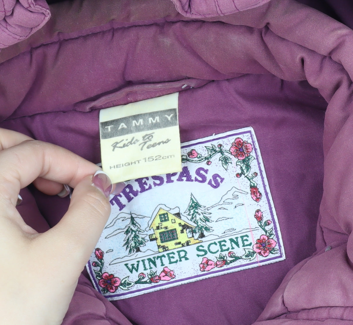 Close-up detail of Trespass girls’ purple parka coat, hooded, 12 years