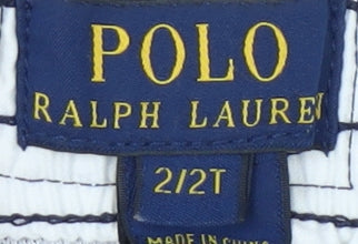 Close-up detail of Polo Ralph Lauren boys’ blue swim trunks, 24 months