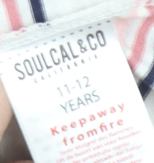 Brand and care label for SoulCal girls’' pink striped t-shirt 11-12 years
