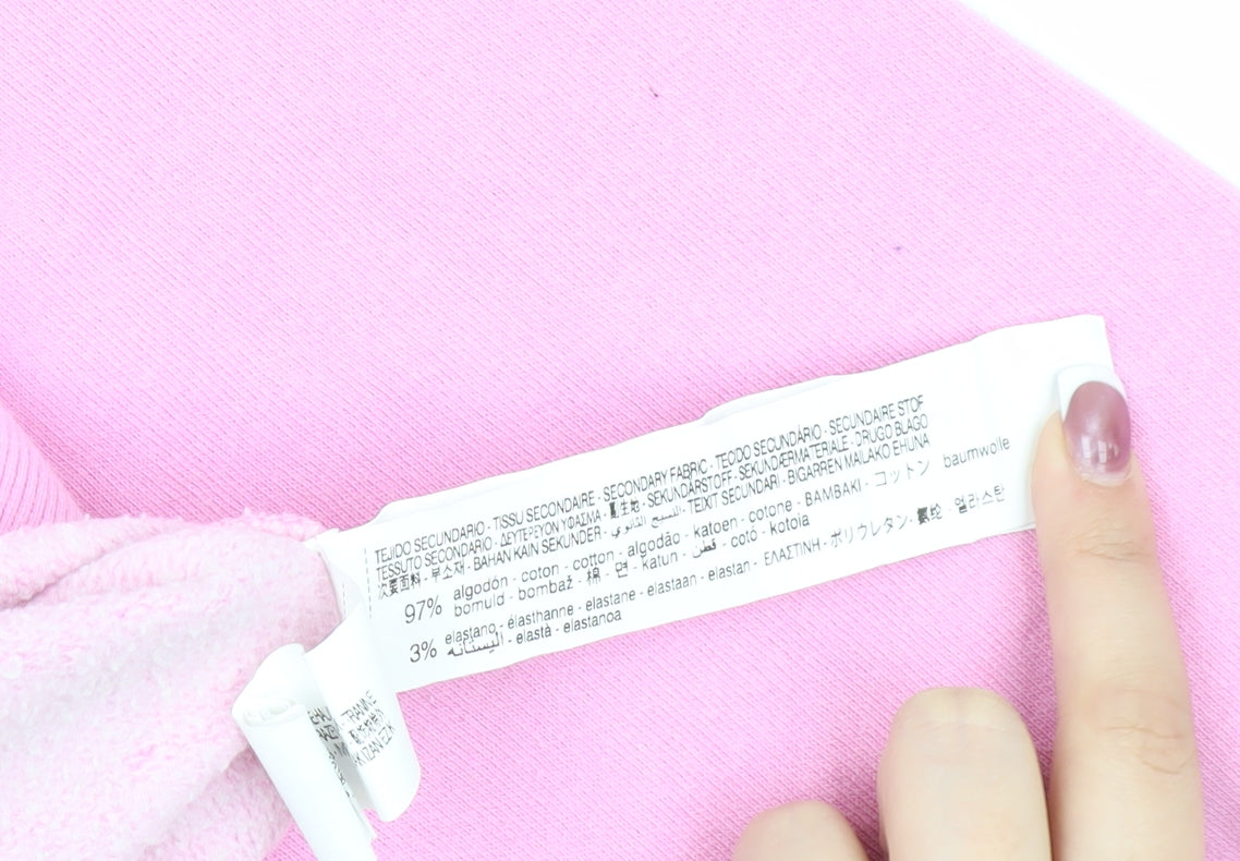 Brand and care label for Zara girls’ pink barbie pullover sweatshirt 9-10 years