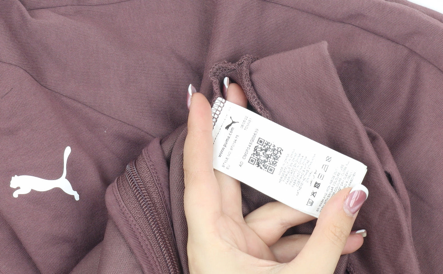 Brand and care label for Puma girls’ brown basic jacket 13-14 years