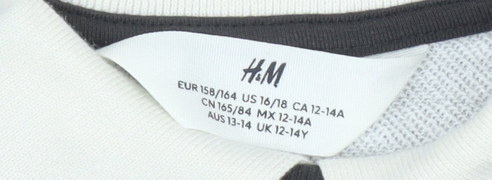 Brand and care label for H&M girls’ black floral sweatshirt pullover 13-14 years