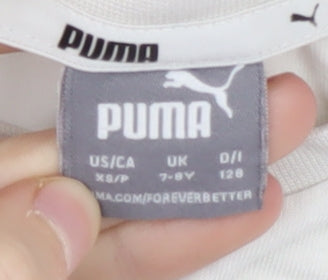 Brand and care label for Puma girls’ beige t-shirt, 7-8 years, crew neck, logo accent