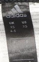 Close-up detail of adidas girls’ black ankle leggings xs elastic waist