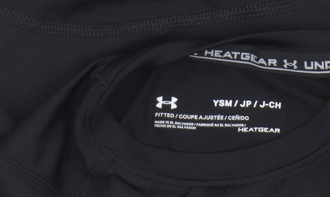 Brand and care label for Under Armour boys’ black athletic long sleeve top