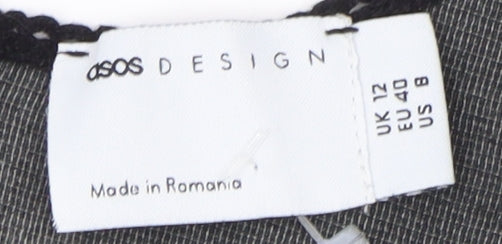 Brand and care label for ASOS Women's Black Polka Dot Dress, size 12