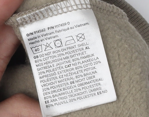 Brand and care label for H&M boys’ beige marvel sweatshirt 9-10 years