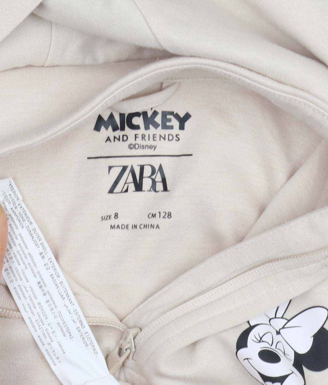 Close-up detail of Zara girls’ beige minnie mouse hoodie, size 8, years