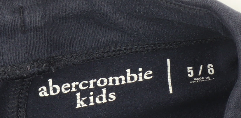 Brand and care label for Abercrombie & Fitch Kids girls’ blue athletic shorts, size 5-6, years