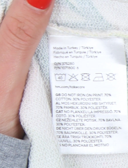 Brand and care label for H&M girls’' beige green abstract pullover sweatshirt 12-13y
