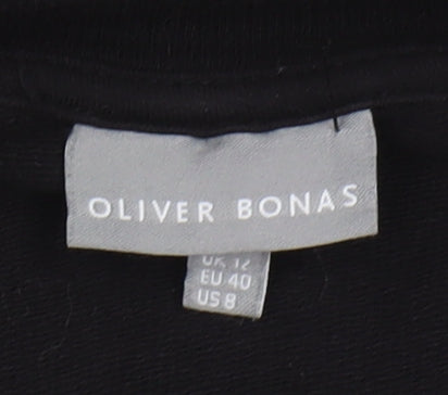 Brand and care label for Oliver Bonas Black Feather Accented Dress, size 12