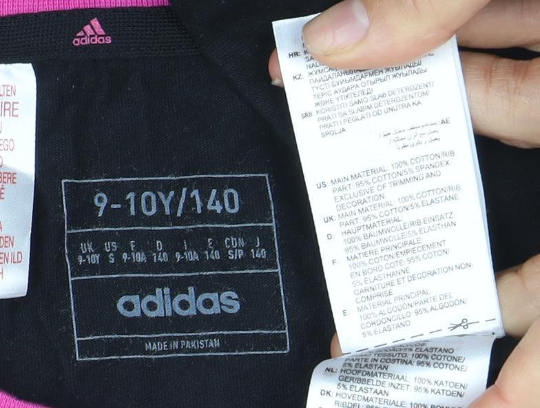 Close-up detail of Adidas girls’ black t-shirt 9-10y jersey with pink accents