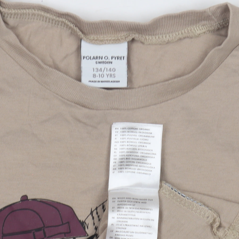 Close-up detail of Polarn O. Pyret girls’ beige owl graphic t-shirt, size 8-9