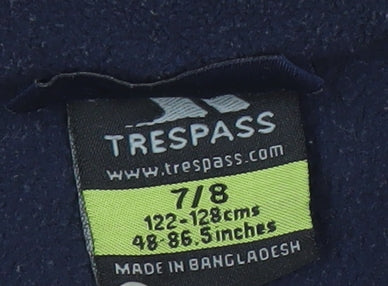 Brand and care label for Trespass boys’ blue fleece activewear jacket, size 7-8