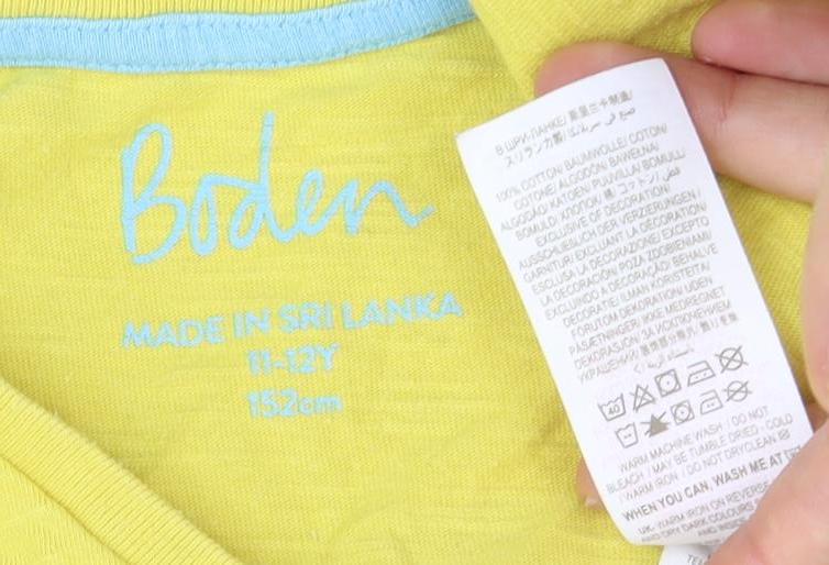 Close-up detail of Boden girls’ yellow cotton crew neck t-shirt 11-12 years