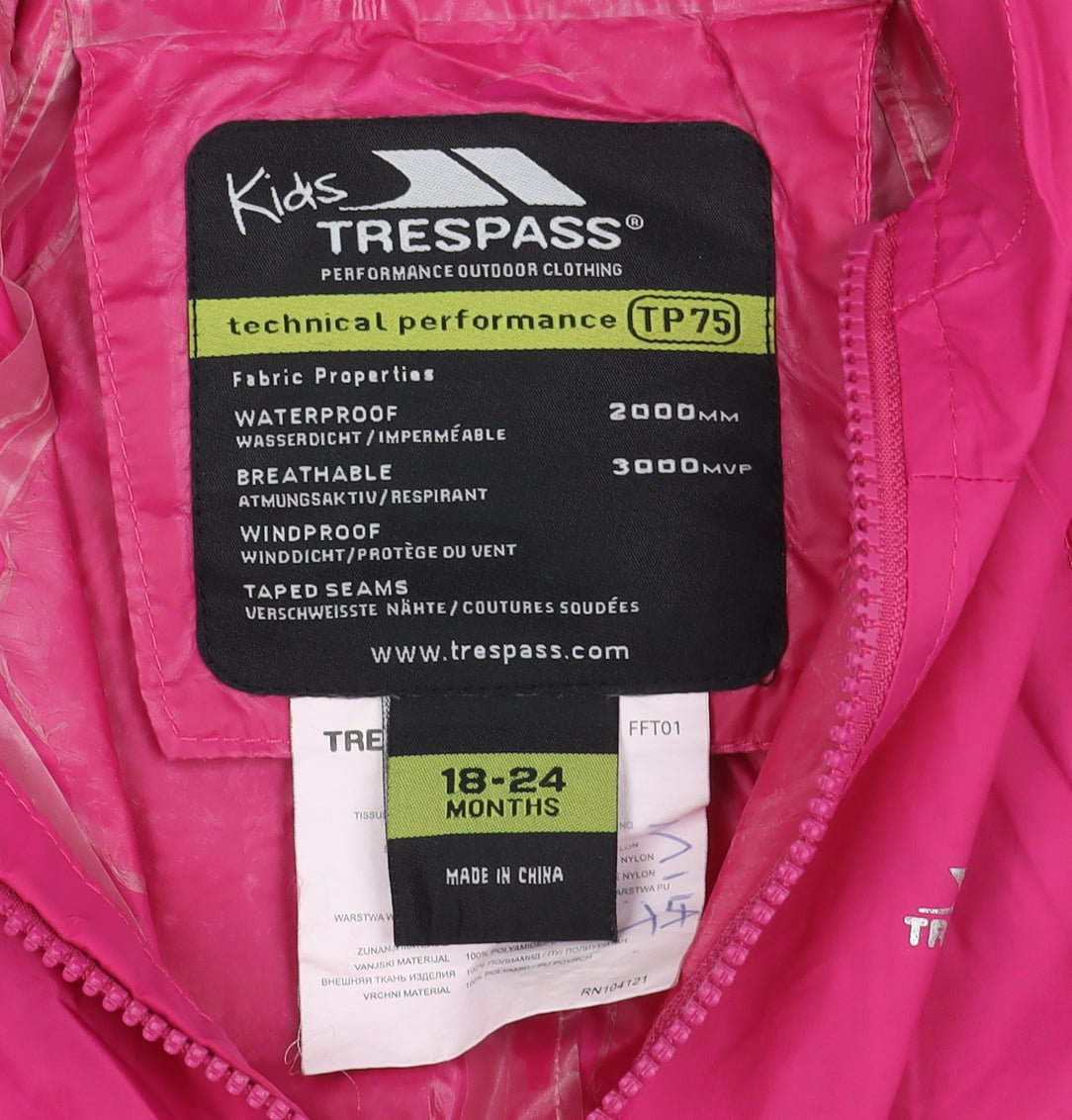 Brand and care label for Trespass girls’ pink snowsuit, size 18-24, months, waterproof