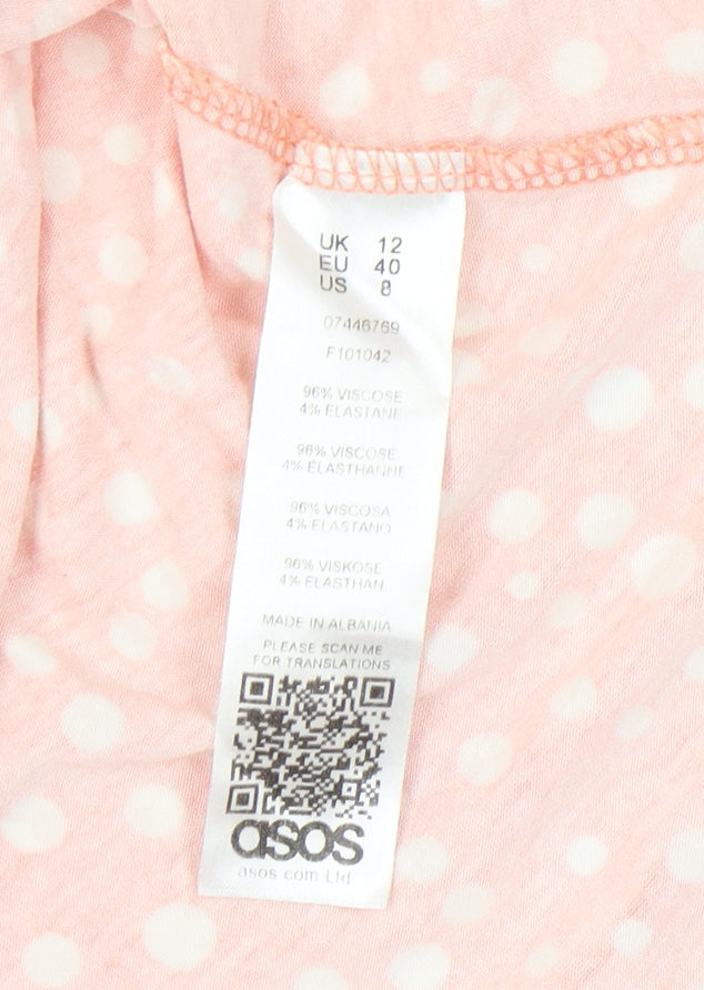 Close-up detail of ASOS Women's Orange Polka Dot Dress, size 12