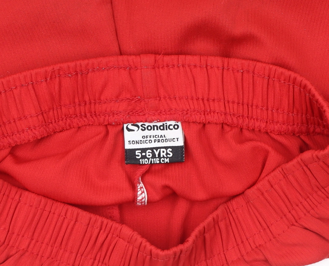 Close-up detail of Sondico boys’' red athletic shorts 5-6 years - football activewear