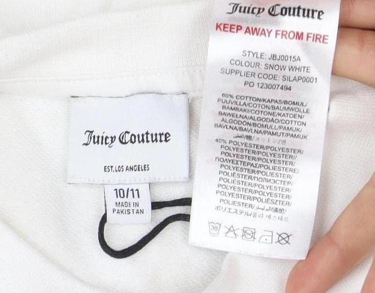 Close-up detail of Juicy Couture girls’ white pullover sweatshirt, 11 years