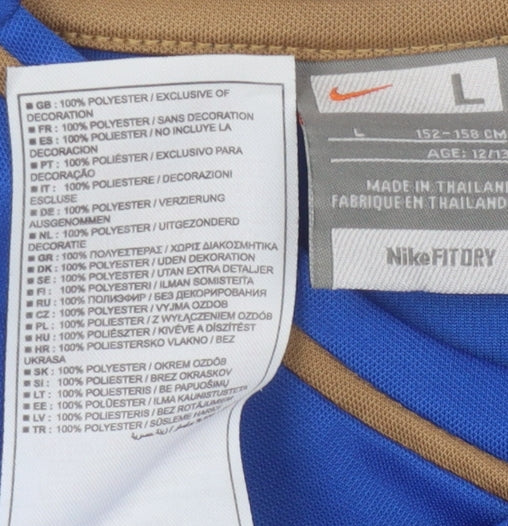 Close-up detail of Nike boys’ blue sports jersey l - lightweight & breathable top