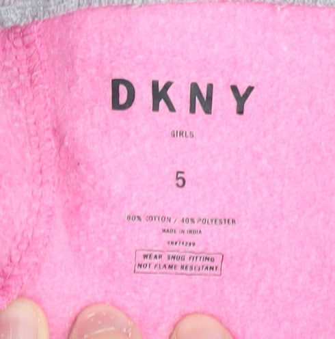 Close-up detail of DKNY girls’ pink jogger trousers, size 5, elastic waist