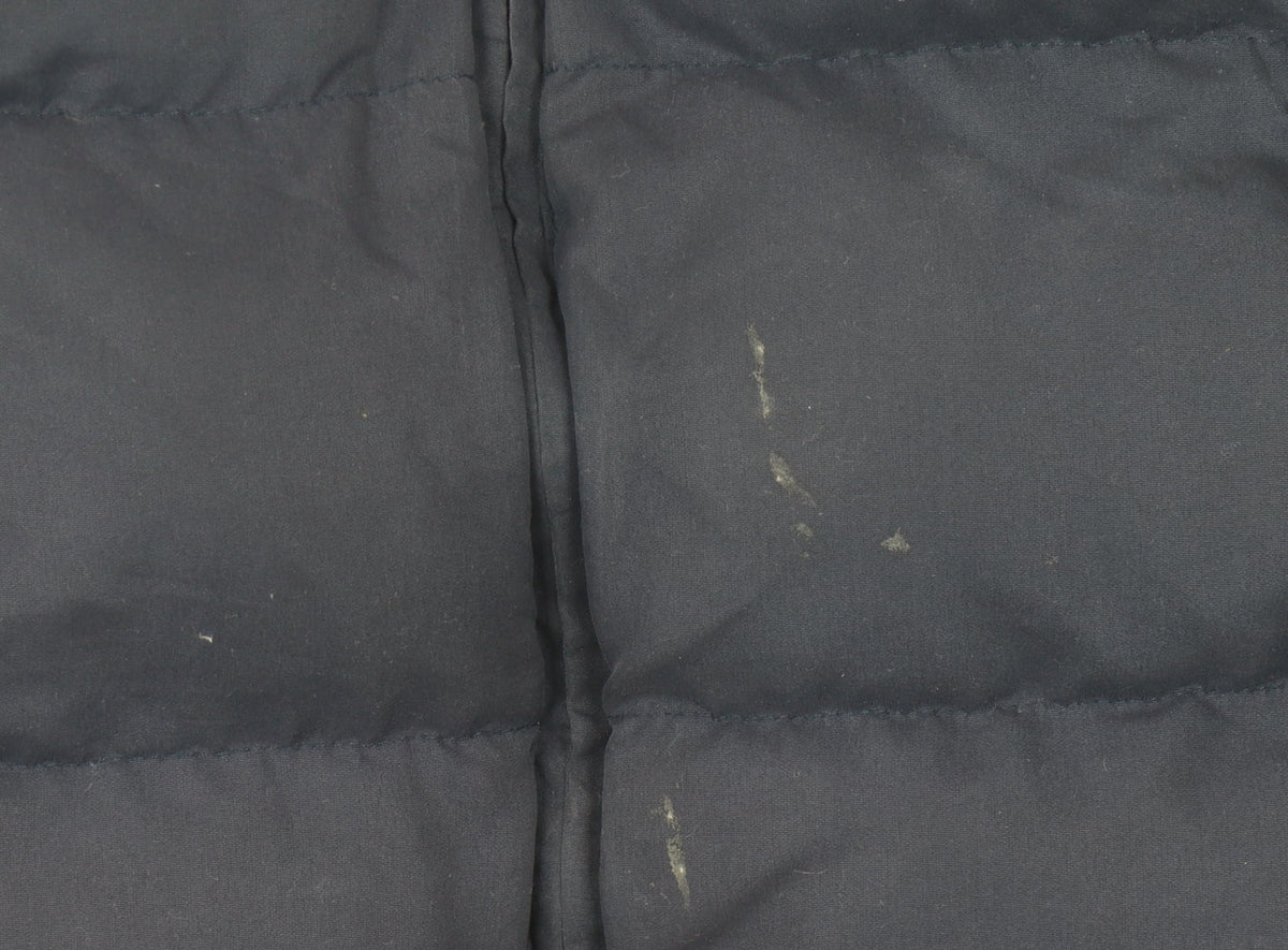 Brand and care label for CAT boys’ blue puffer jacket, size 8, years