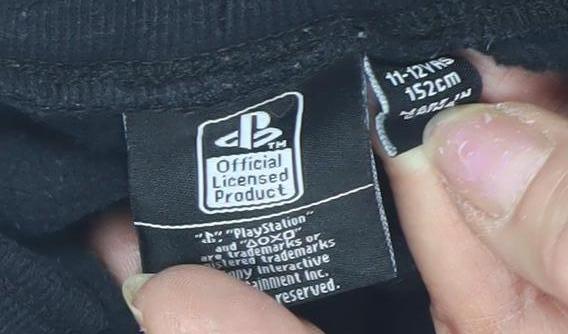 Close-up detail of PlayStation boys’ black jogger trousers 11-12 years