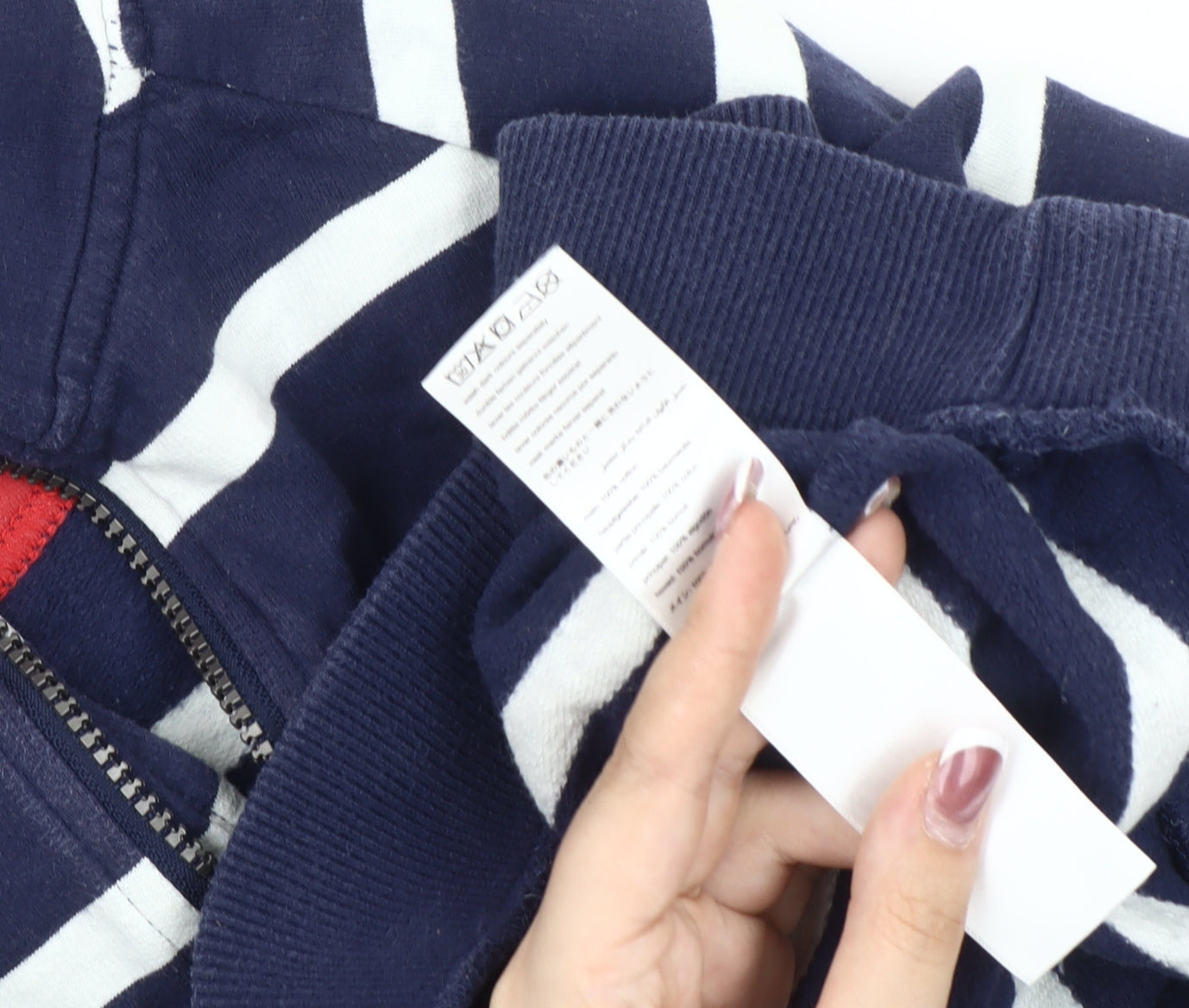 Brand and care label for Joules boys’ navy stripe 1/4 zip sweater - age 9