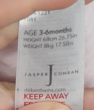 Brand and care label for Debenhams Pink girls’ babygrow, 3-6 months, cotton, embroidered