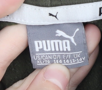 Brand and care label for Puma boys’ green hoodie pullover 13-14 years logo design