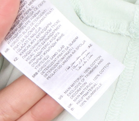 Brand and care label for Adidas Women's Green Medium Cotton T-Shirt