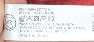 Brand and care label for Maine New England Women's Red V-Neck Cotton Short Sleeve Sweater