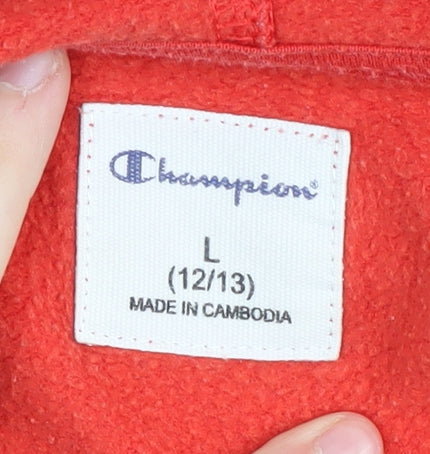 Brand and care label for Champion boys’ red pullover hoodie, size L, logo accent