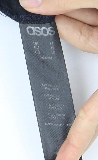 Close-up detail of ASOS Women's Black Relaxed Trousers, size 14