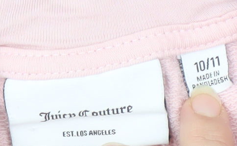 Brand and care label for Juicy Couture girls’ pink full zip hoodie 10-11 years