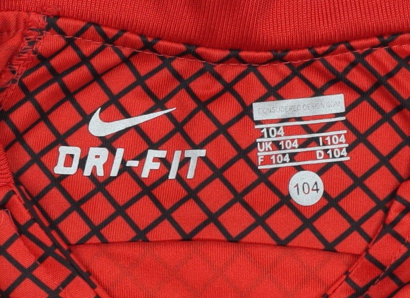 Close-up detail of Nike boys’ red football jersey, size 104, - breathable & sporty
