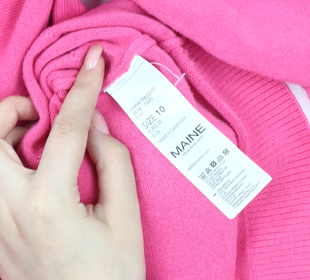 Brand and care label for Maine New England Women's Pink Knit jumper, size 10