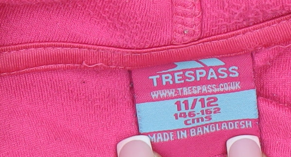 Close-up detail of Trespass girls’ pink fleece jacket, hooded, 11-12 years