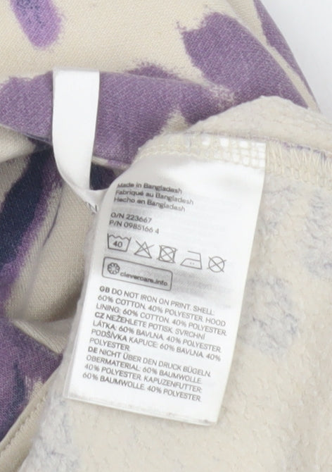 Brand and care label for H&M girls’ purple tie-dye hoodie, size 12, urban style