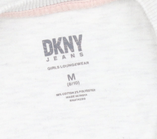 Close-up detail of DKNY girls’ white graphic t-shirt, 8 years, casual designer top