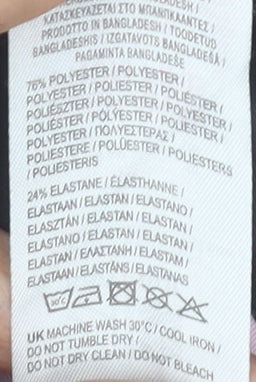Brand and care label for Karrimor girls’ black running leggings 9-10 years