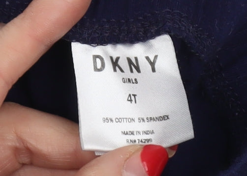 Close-up detail of DKNY girls’ blue ankle leggings 4 years cotton elastane