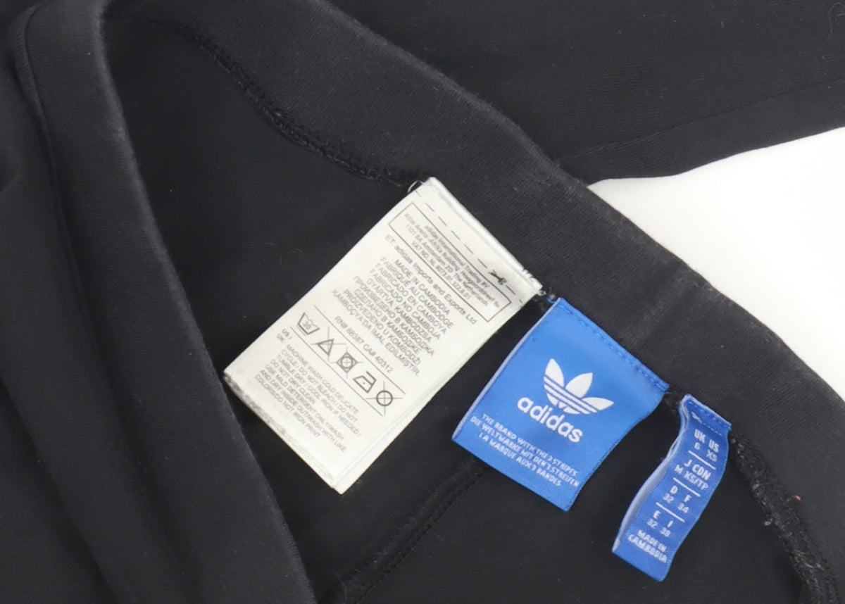 Close-up detail of Adidas girls’ black leggings xs slim fit activewear