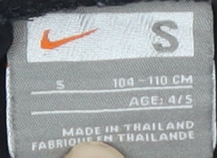 Brand and care label for Nike boys’ black athletic football shorts, size S