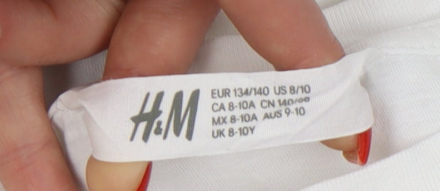 Close-up detail of H&M girls’ white adventure graphic t-shirt 8-10 years