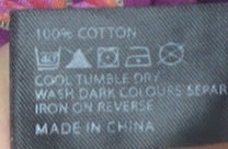 Brand and care label for Ted Baker girls’ purple blouse 3-6 months short sleeve