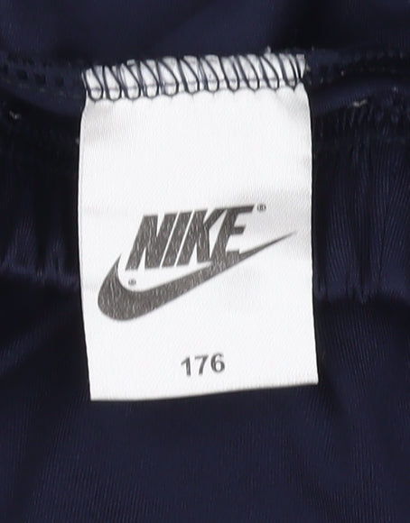 Close-up detail of Nike boys’ blue athletic football shorts, size 176