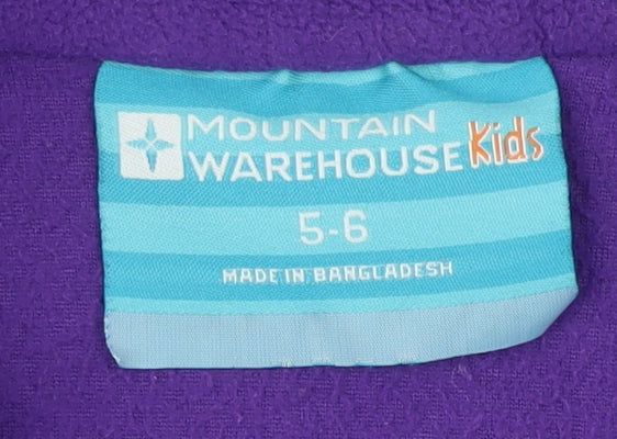 Brand and care label for Mountain Warehouse girls’ purple fleece sweatshirt 5-6 years
