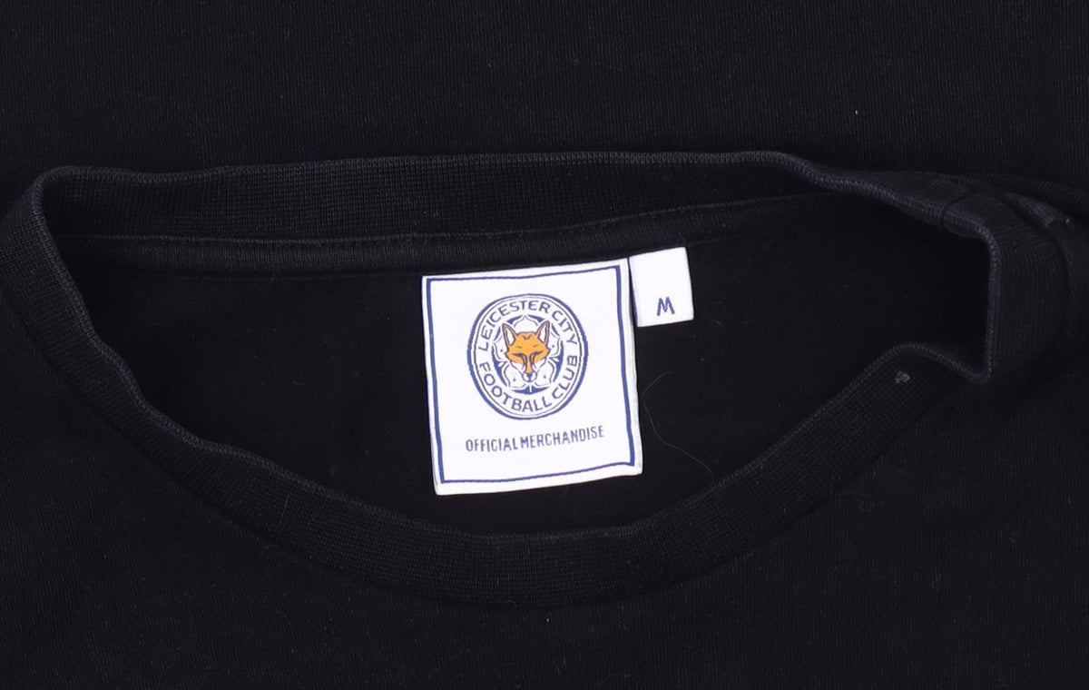 Close-up detail of Leicester City FC Men's M Black/Green Colourblock T-Shirt