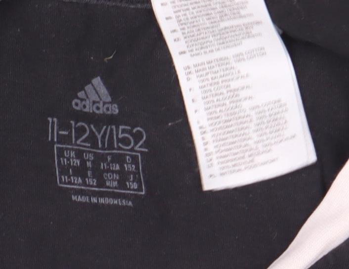 Close-up detail of Adidas boys’' black t-shirt 11-12 years, short sleeve, cotton